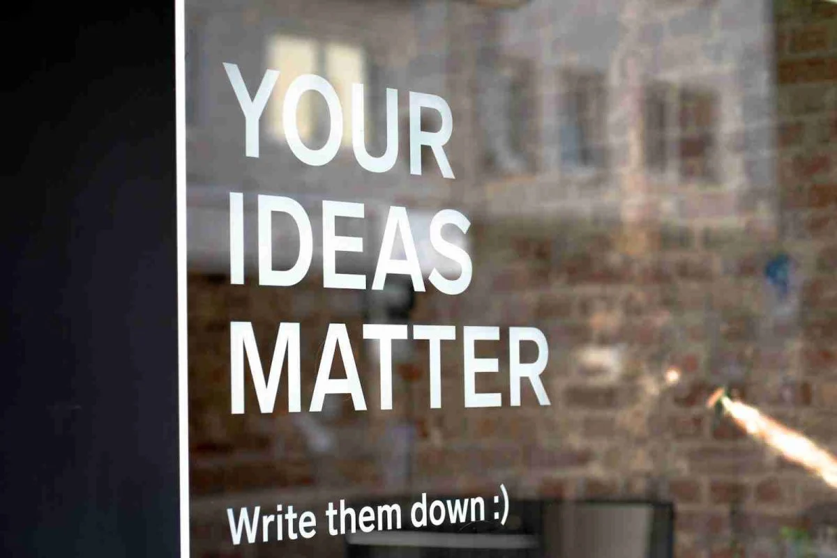 Window graphic reading 'Your ideas matter, write them down'